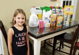 Sloan presenting gifts to FURR - Oct 2017